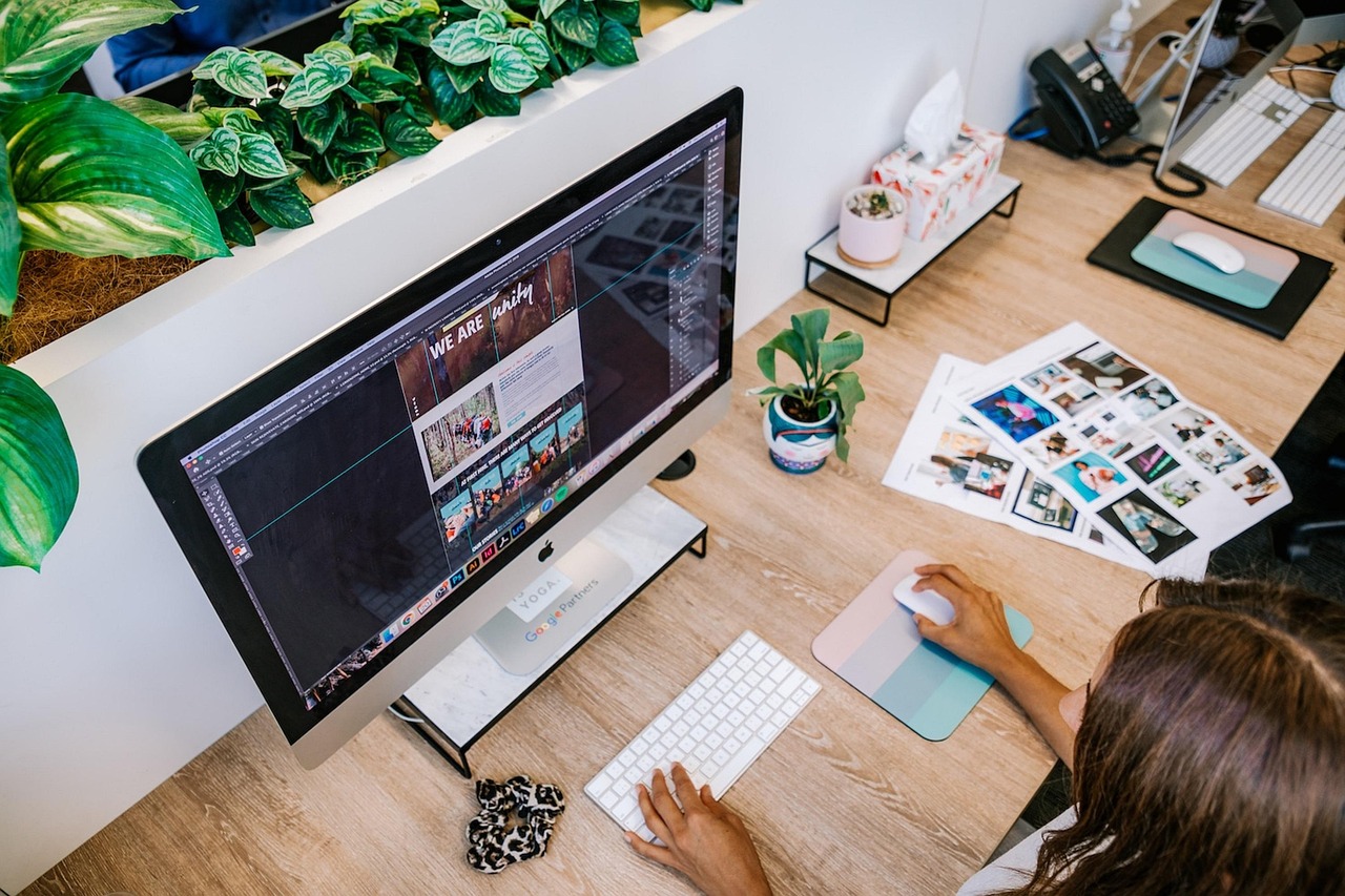 Creative web design workspace with laptop screens